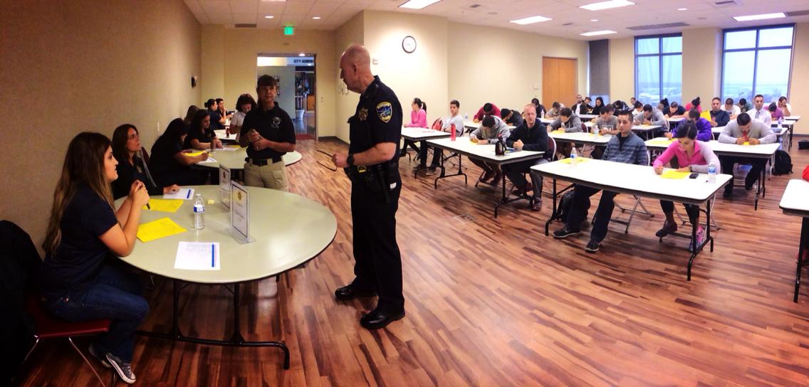Participant standing next to table